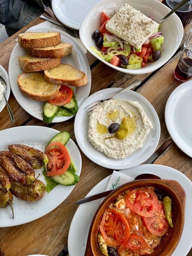 Greek appetizers, olives, feta cheese and stuffed peppers