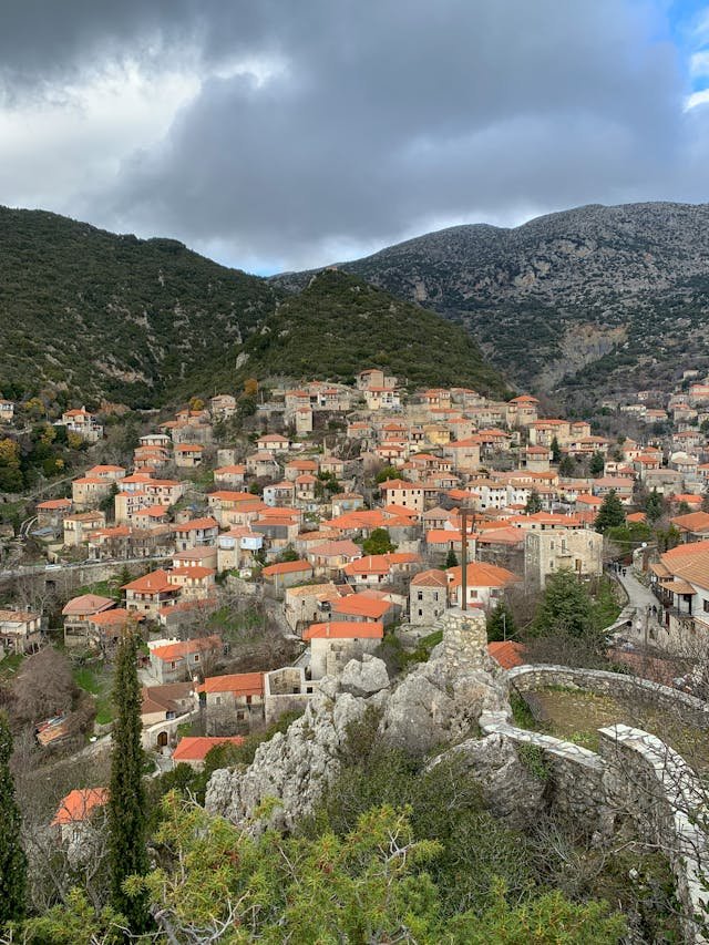 Traditional village in Arcadia, with stone houses and lush green forests